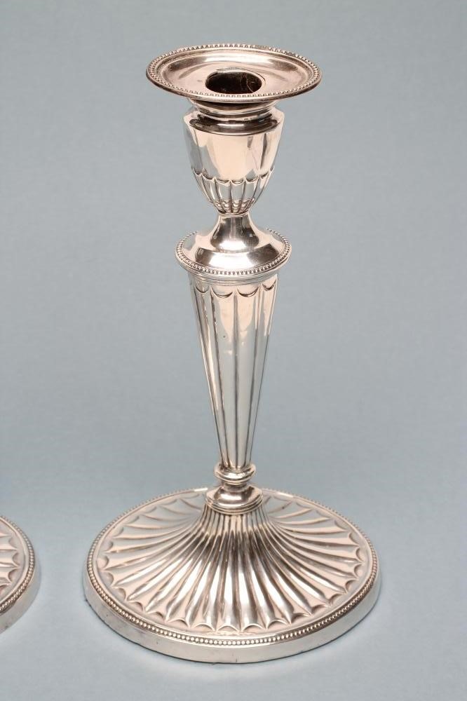 A PAIR OF LATE VICTORIAN SILVER CANDLESTICKS Image
