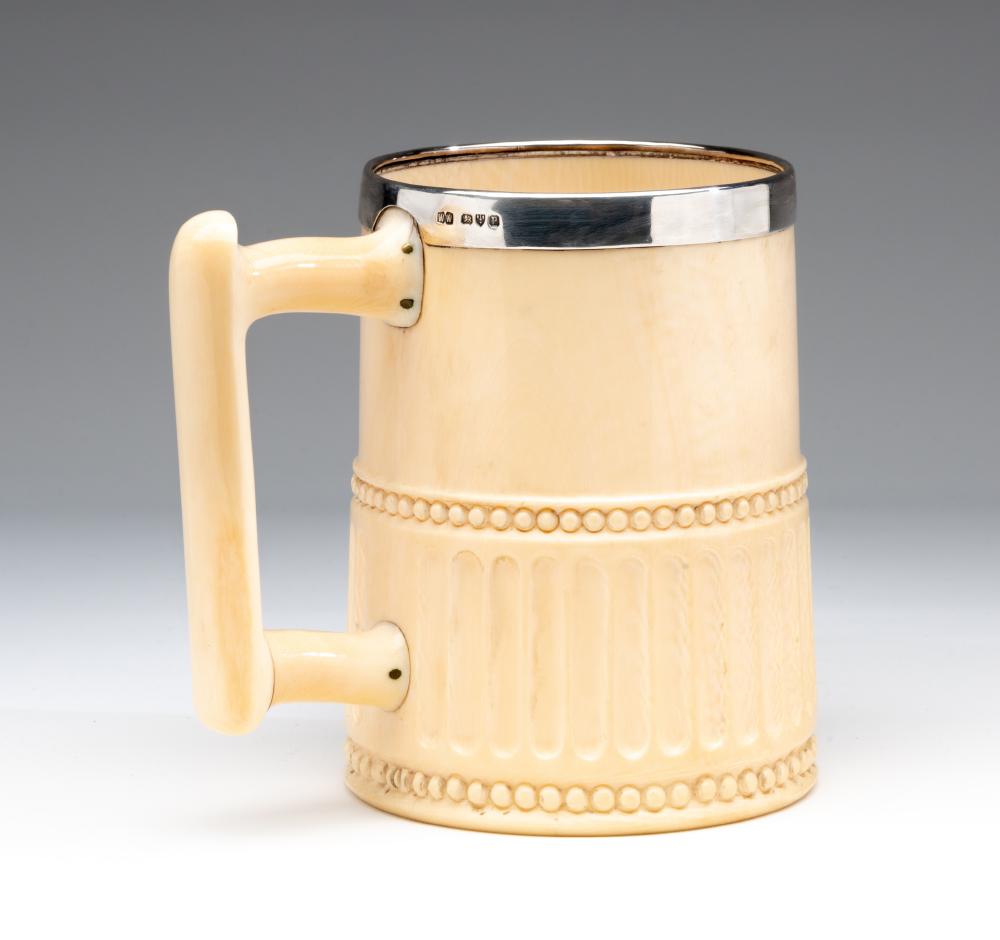 A LATE VICTORIAN SILVER MOUNTED IVORY MUG Image