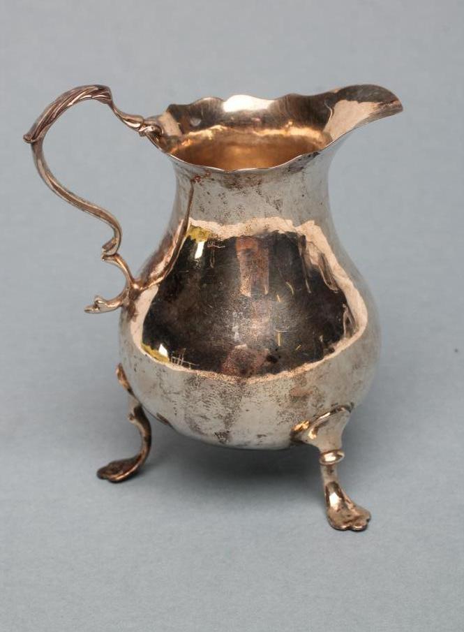 A GEORGE II SILVER CREAM JUG Image