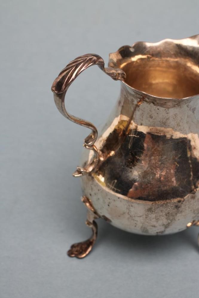 A GEORGE II SILVER CREAM JUG Image