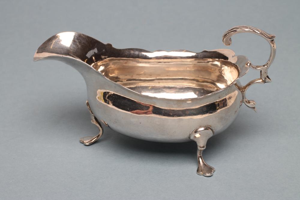 A GEORGE III SILVER SAUCEBOAT Image