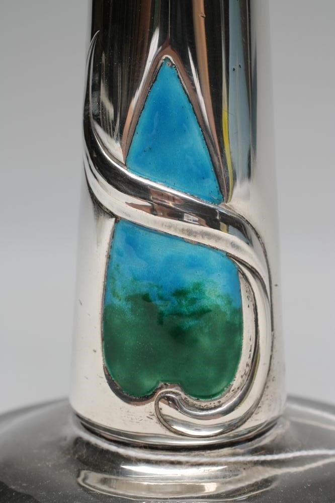 A PAIR OF EDWARDIAN ARTS AND CRAFTS SILVER AND ENAMEL CANDLESTICKS Image