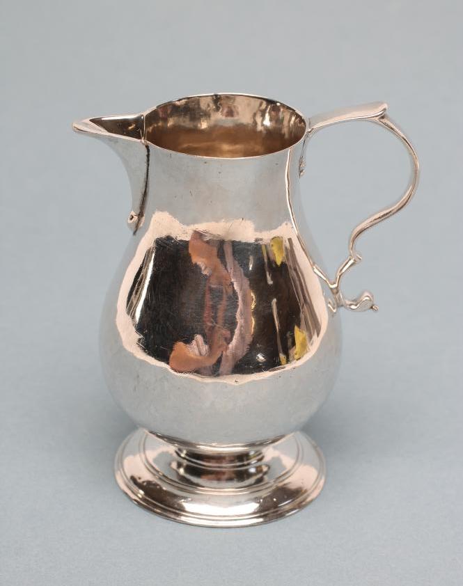 A GEORGE II SILVER SPARROW BEAK CREAM JUG Image