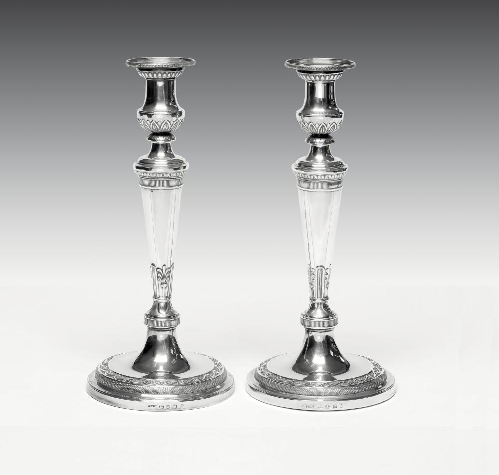 A COMPOSITE PAIR OF LATE GEORGE III SILVER CANDLESTICKS Image