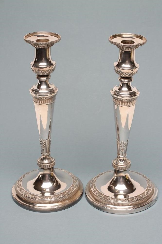 A COMPOSITE PAIR OF LATE GEORGE III SILVER CANDLESTICKS Image