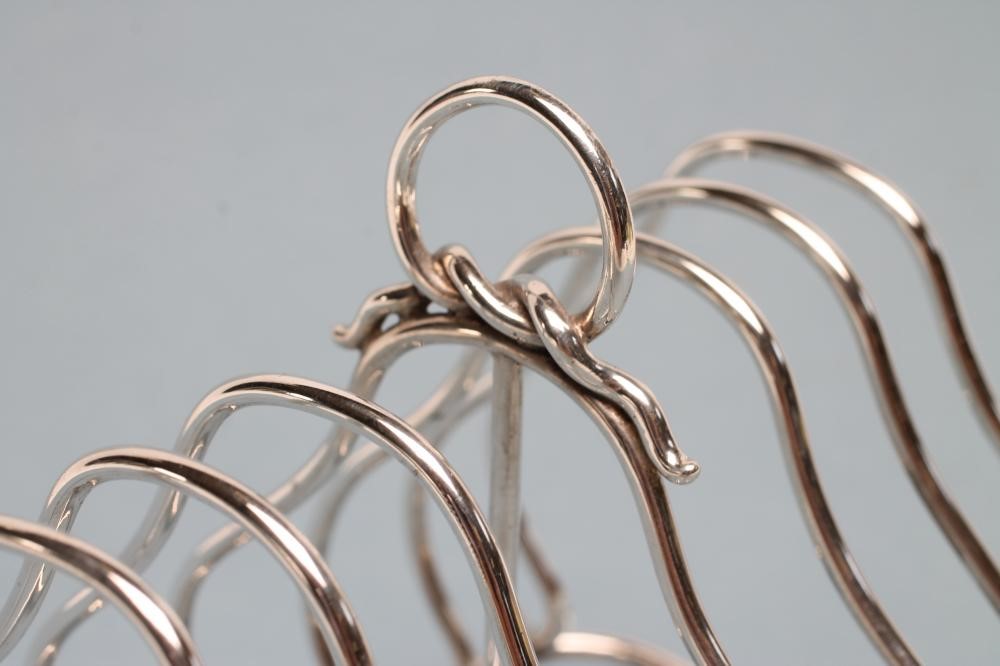 A VICTORIAN SILVER SEVEN BAR WIREWORK TOASTRACK Image