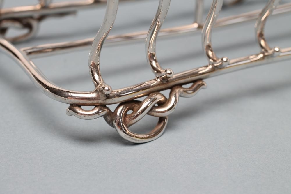 A VICTORIAN SILVER SEVEN BAR WIREWORK TOASTRACK Image