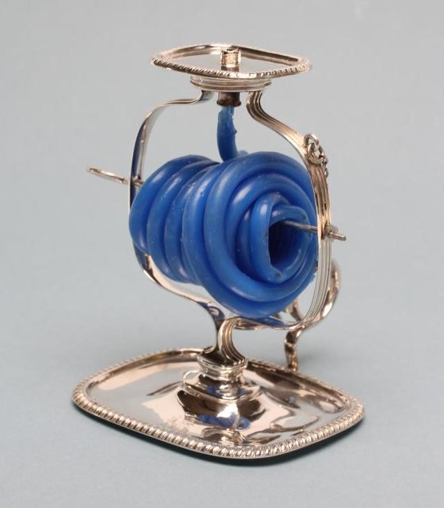 A LATE GEORGE III SILVER WAX JACK Image