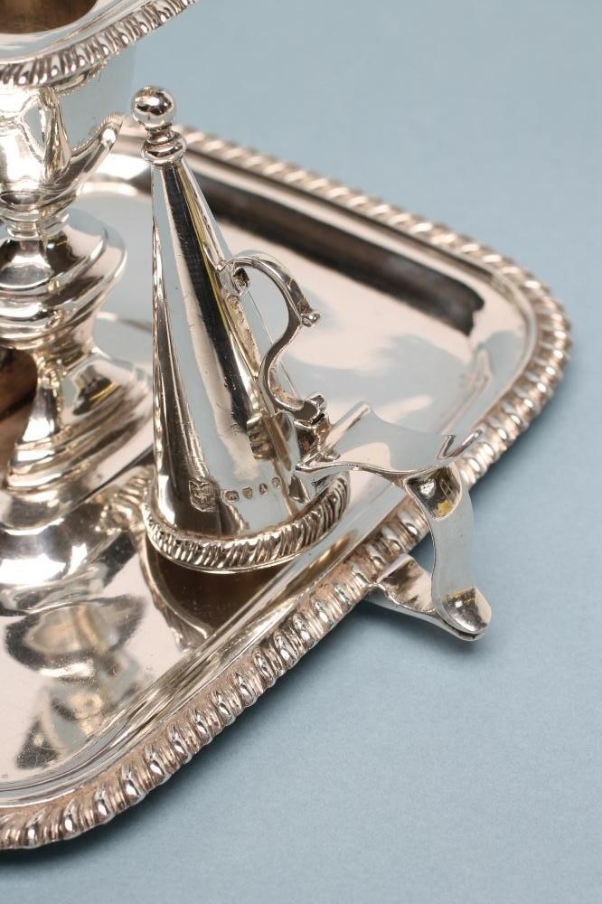 A VICTORIAN SILVER CHAMBERSTICK AND CONICAL SNUFFER Image