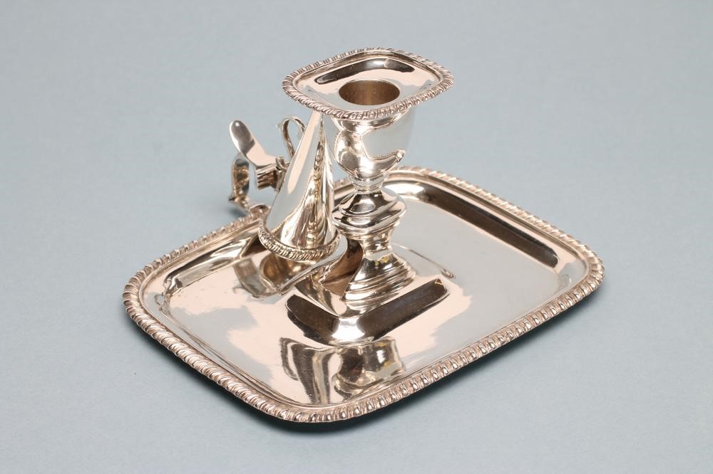 A VICTORIAN SILVER CHAMBERSTICK AND CONICAL SNUFFER Image