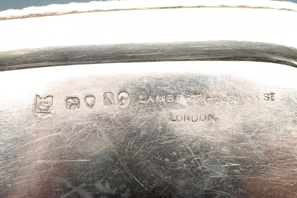 A VICTORIAN SILVER CHAMBERSTICK AND CONICAL SNUFFER Image