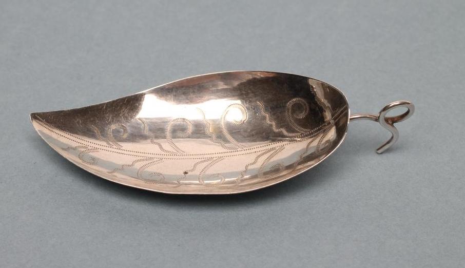A GEORGE III SILVER CADDY SPOON Image
