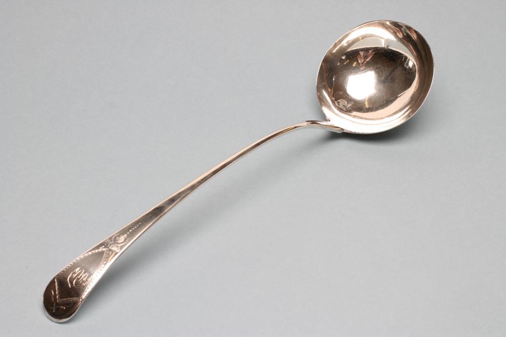 A LATE GEORGE III SILVER SOUP LADLE Image