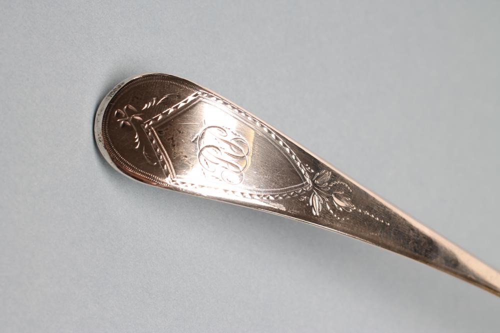 A LATE GEORGE III SILVER SOUP LADLE Image