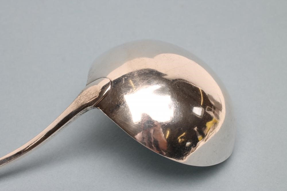 A LATE GEORGE III SILVER SOUP LADLE Image