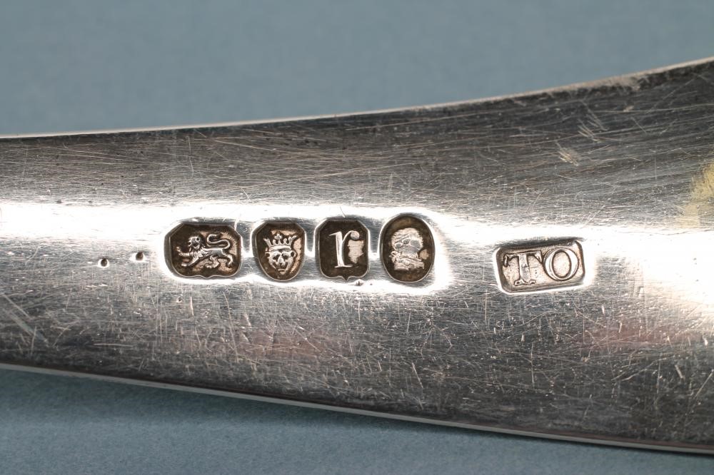 A LATE GEORGE III SILVER SOUP LADLE Image