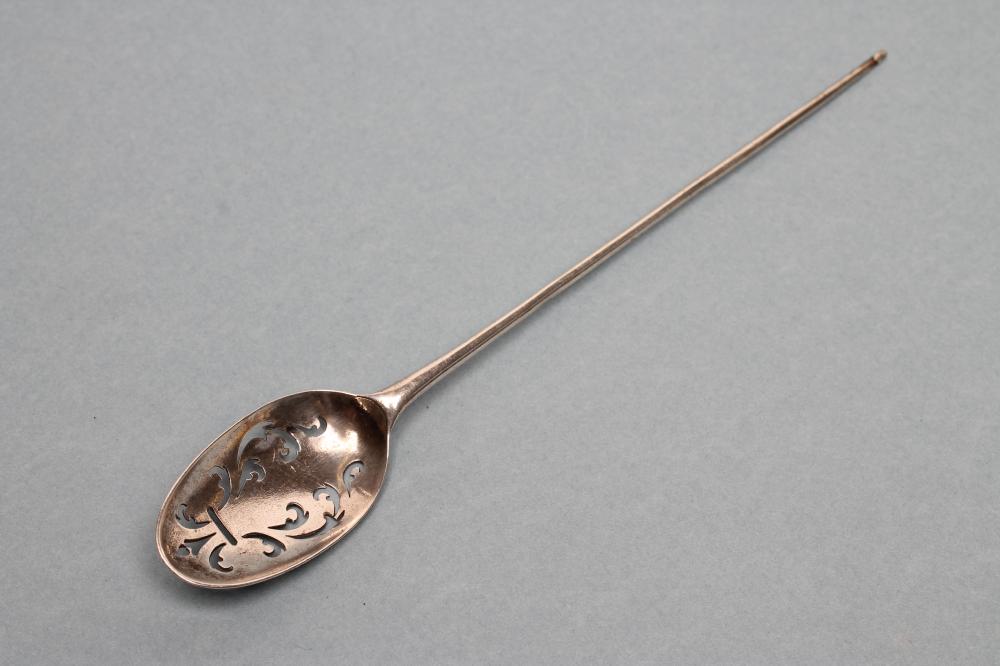 A GEORGE III SILVER MOTE SPOON Image