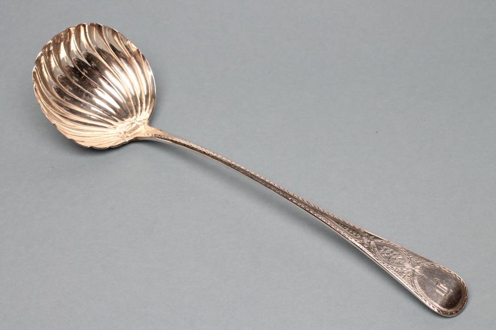 A LATE GEORGE III SILVER SOUP LADLE Image