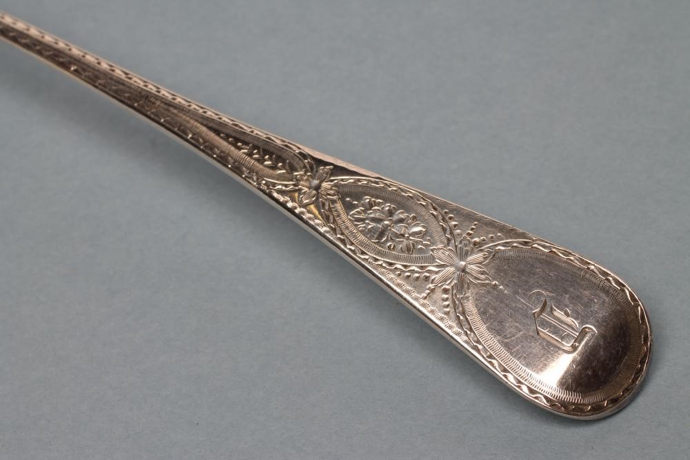 A LATE GEORGE III SILVER SOUP LADLE Image