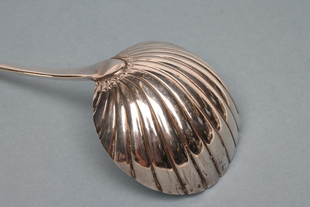 A LATE GEORGE III SILVER SOUP LADLE Image