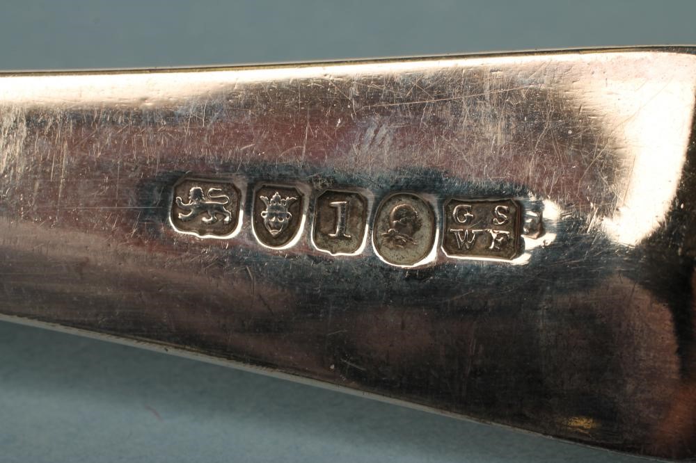 A GEORGE III SILVER SOUP LADLE Image