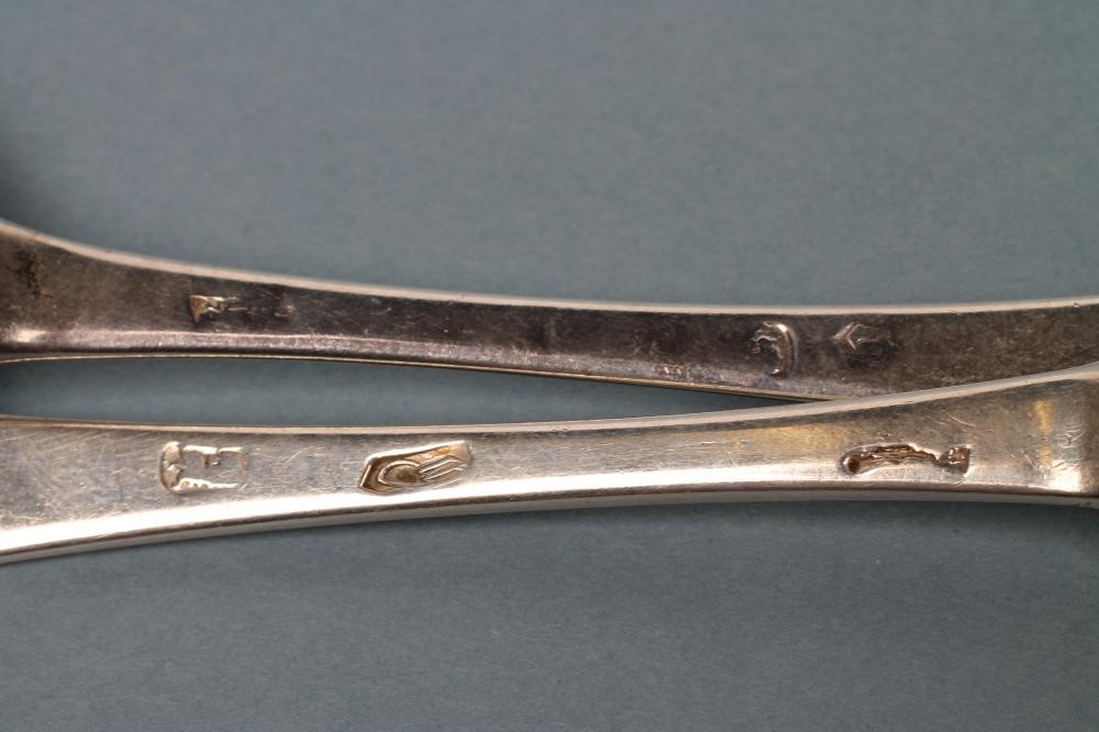 A PAIR OF QUEEN ANNE SILVER "DOG NOSE" SPOONS Image