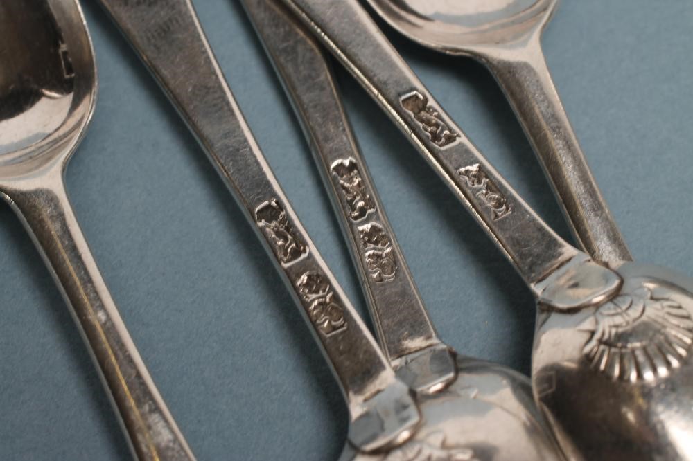 A SET OF SIX GEORGE II SILVER "SHELL BACK" TEASPOONS Image