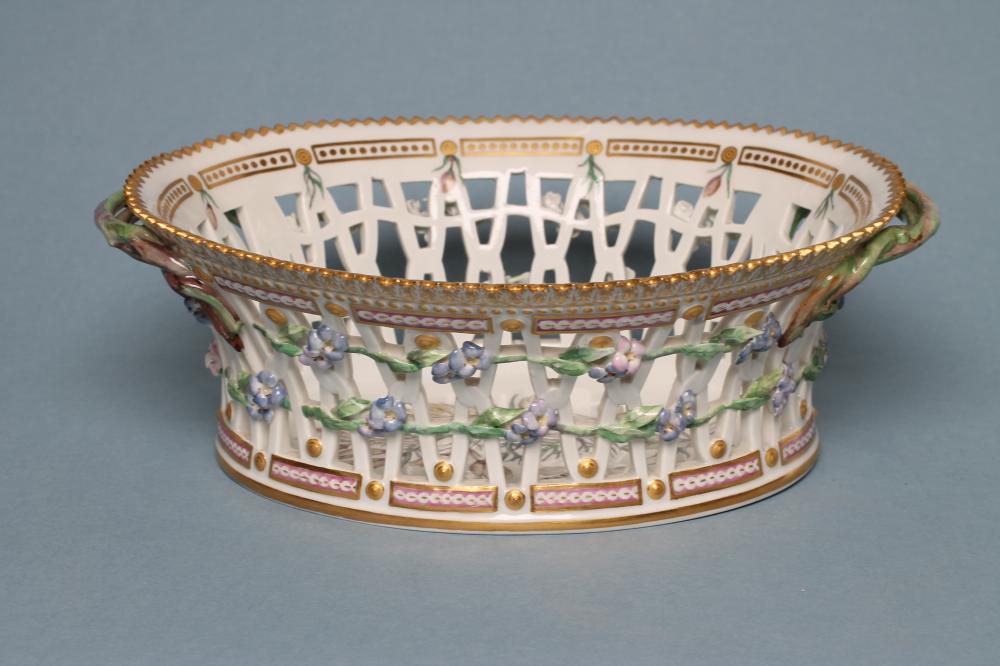 A ROYAL COPENHAGEN PORCELAIN "FLORA DANICA" BASKET of flared oval form with two naturalistic twig Image
