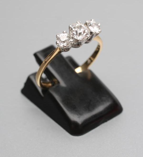 A THREE STONE DIAMOND RING Image