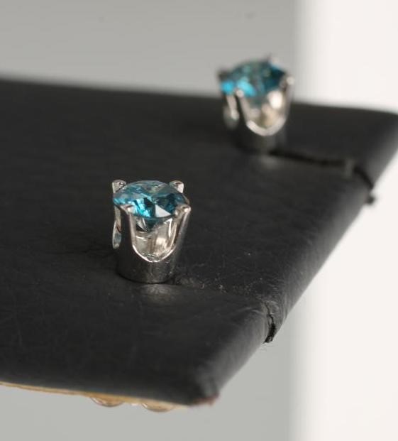 A PAIR OF BLUE DIAMOND EAR STUDS Image