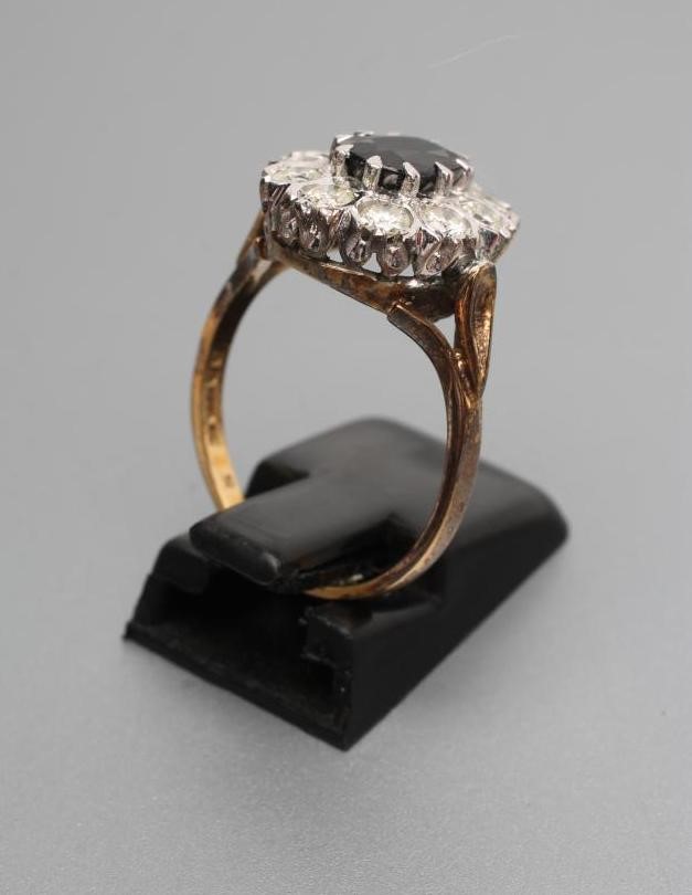 A SAPPHIRE AND DIAMOND CLUSTER RING Image