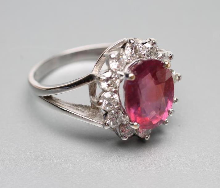 A RUBY AND DIAMOND CLUSTER RING Image