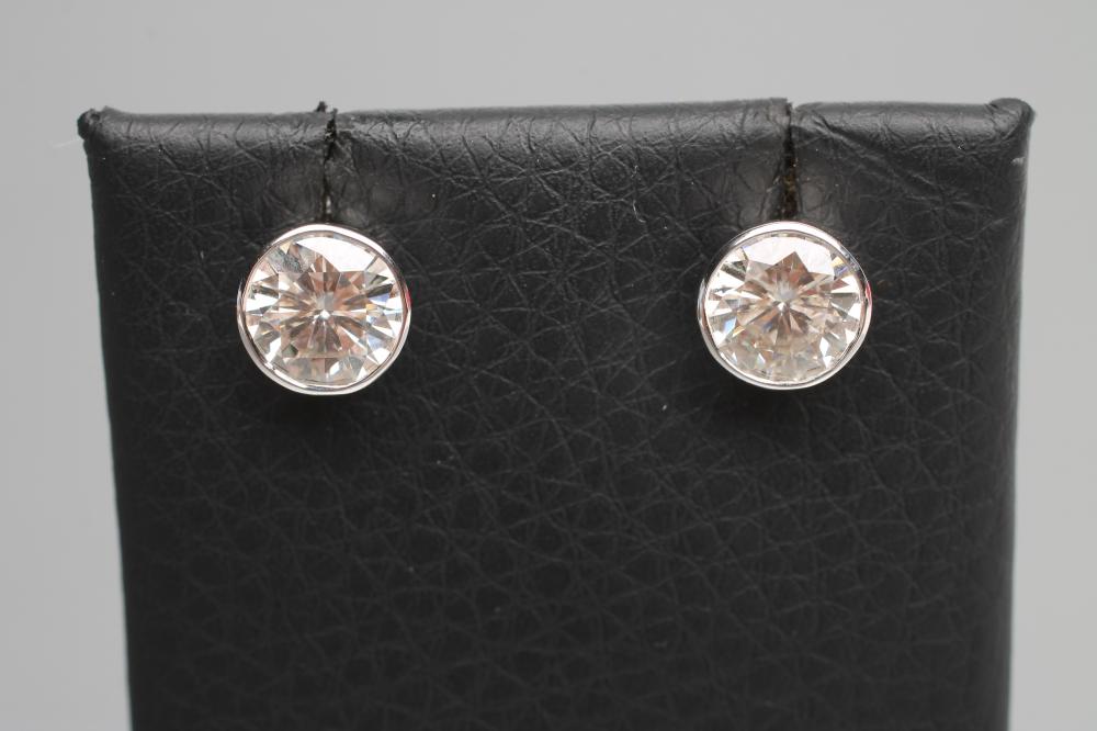 A PAIR OF SOLITAIRE MOISSANITE EAR STUDS Image