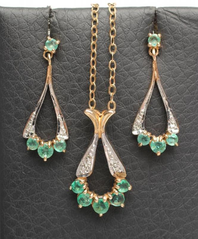 AN EMERALD AND DIAMOND PENDANT WITH MATCHING DROP EAR STUDS Image