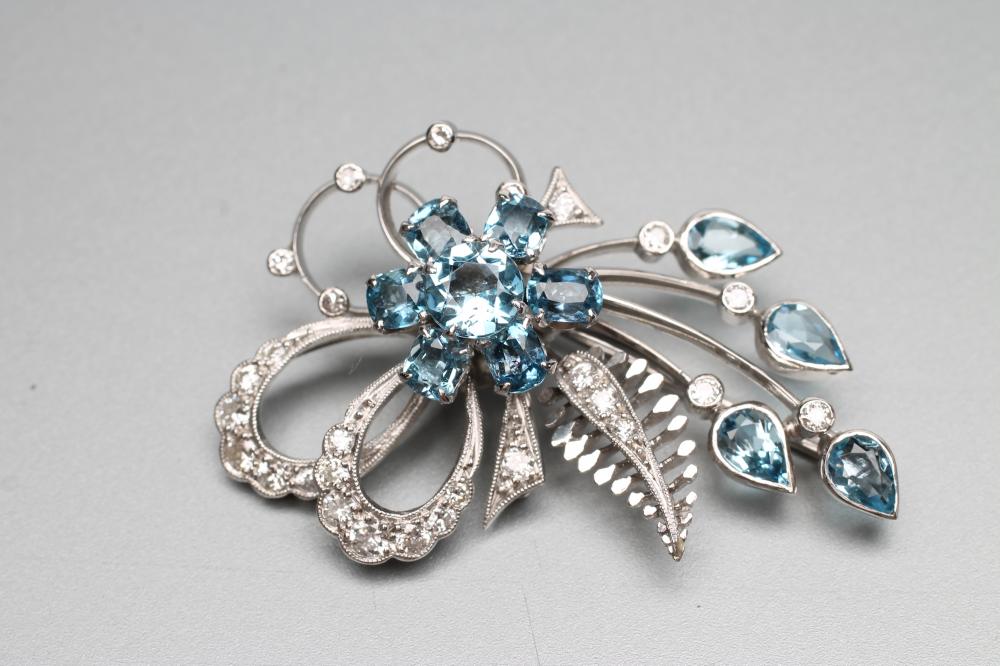 A BLUE ZIRCON AND DIAMOND SPRAY BROOCH Image