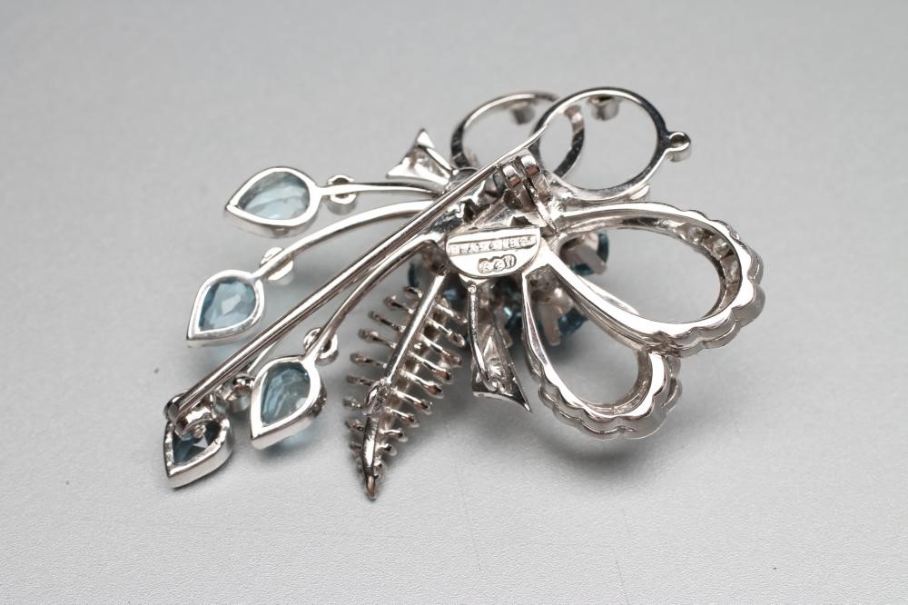 A BLUE ZIRCON AND DIAMOND SPRAY BROOCH Image