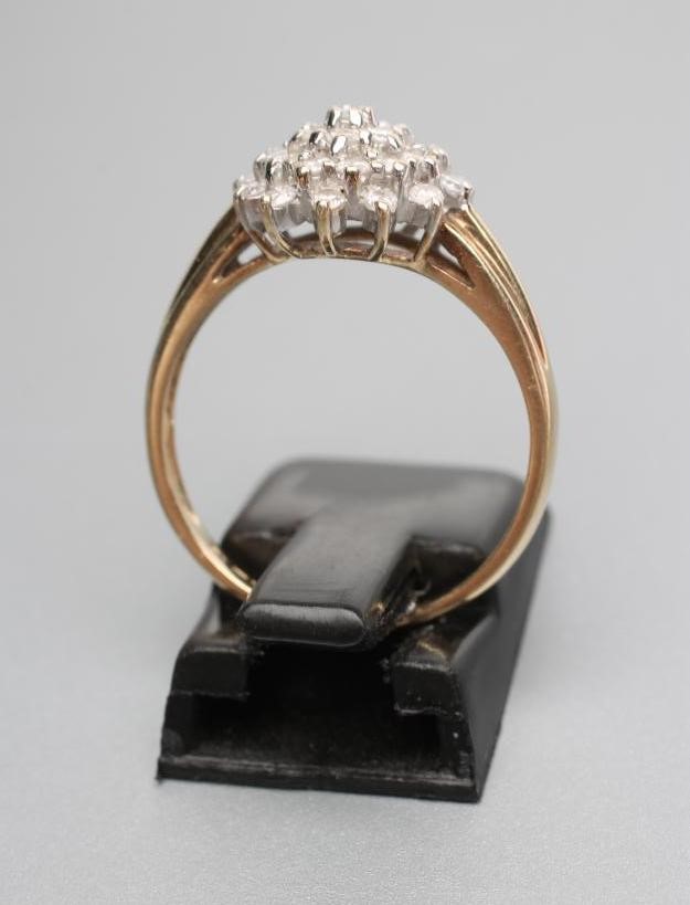 A DIAMOND CLUSTER RING Image