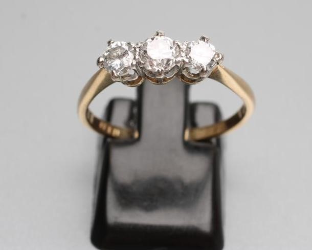 A THREE STONE DIAMOND RING Image