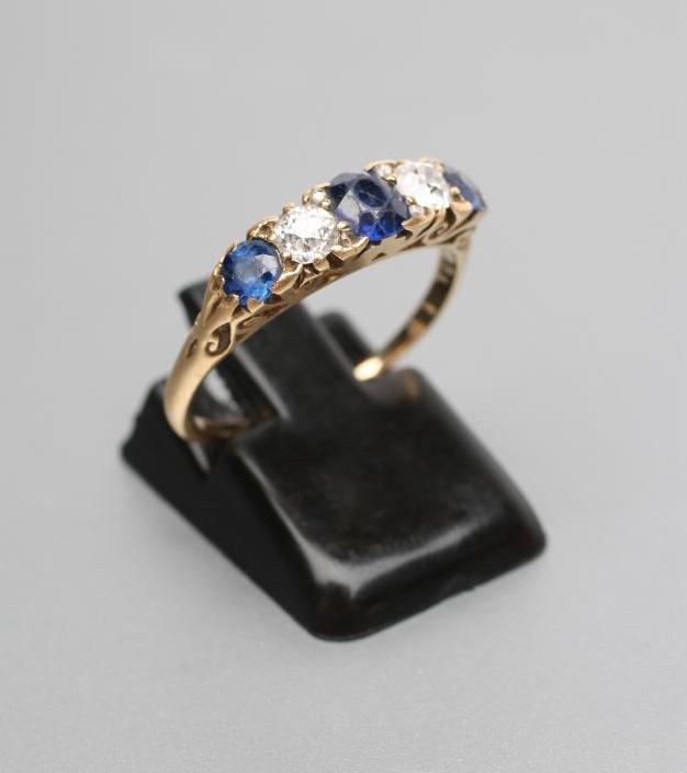 A LATE VICTORIAN FIVE STONE SAPPHIRE AND DIAMOND RING Image