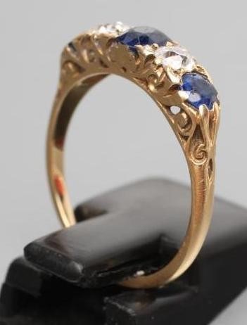 A LATE VICTORIAN FIVE STONE SAPPHIRE AND DIAMOND RING Image