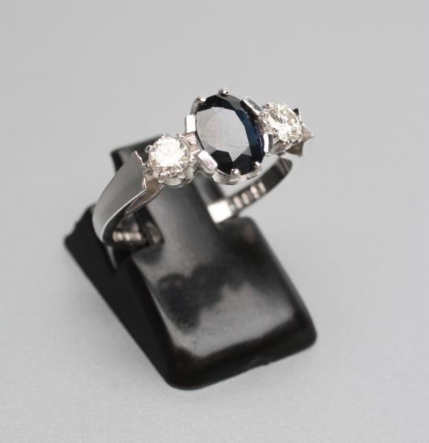 A SAPPHIRE AND DIAMOND THREE STONE RING Image