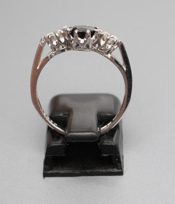 A SAPPHIRE AND DIAMOND THREE STONE RING Image