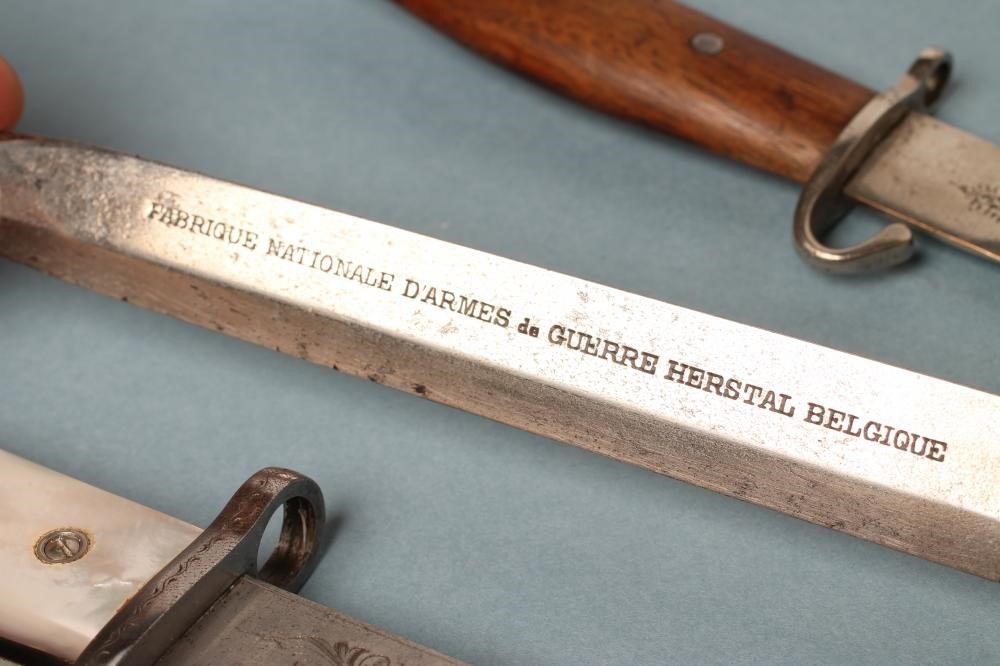 FOUR BELGIAN SOUVENIR MINIATURE BAYONETS Image