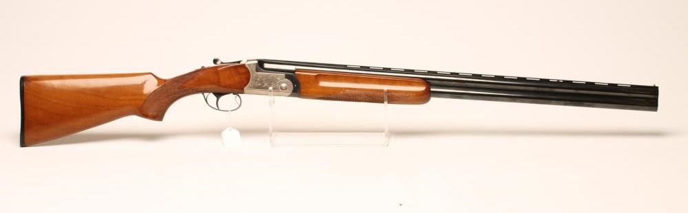 A 12 BORE OVER AND UNDER SHOTGUN by Sarriugarte-Elgoibar Image