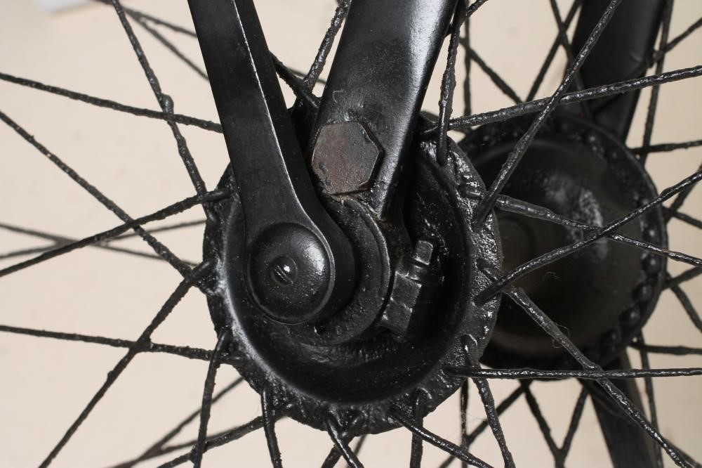 A PENNY FARTHING BICYCLE with stamped metal seat Image