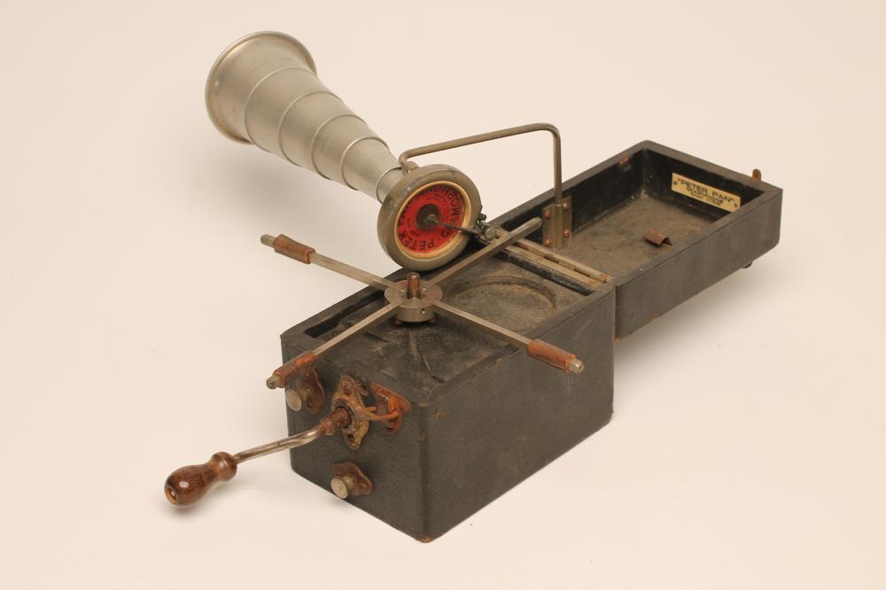 A PETER PAN GRAMOPHONE with folding record platform and collapsing alloy horn Image
