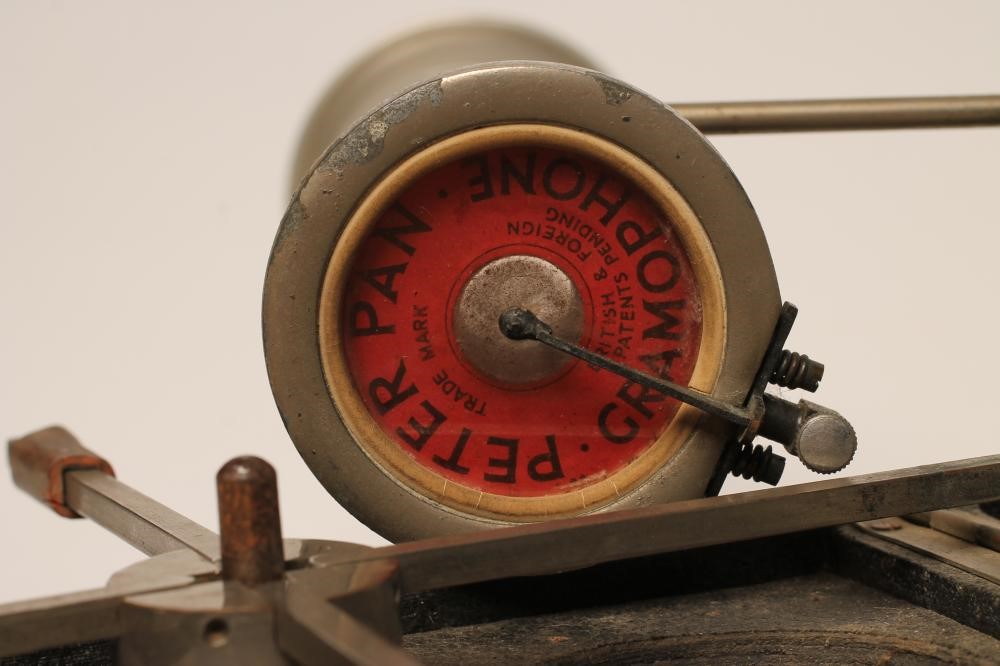 A PETER PAN GRAMOPHONE with folding record platform and collapsing alloy horn Image