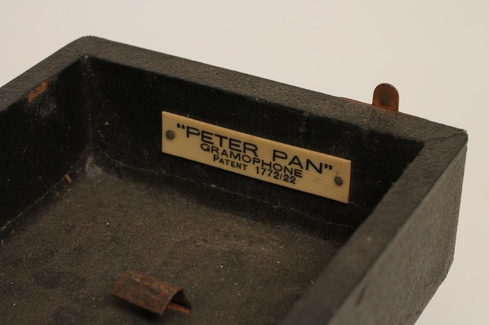 A PETER PAN GRAMOPHONE with folding record platform and collapsing alloy horn Image