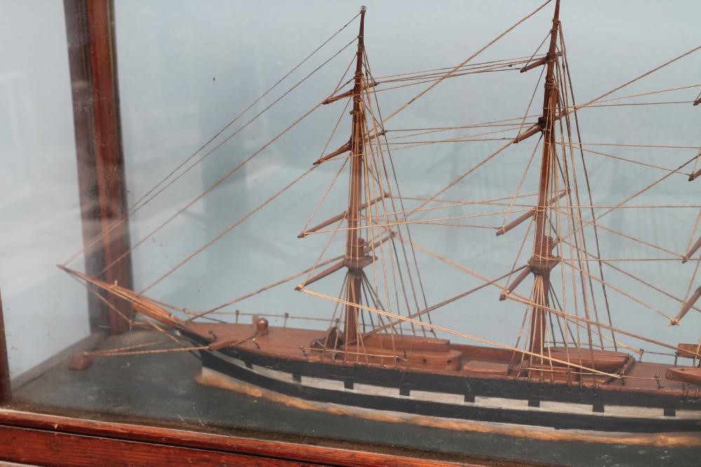 A WOODEN SCALE MODEL OF A BRITISH THREE MASTED SLOOP Image
