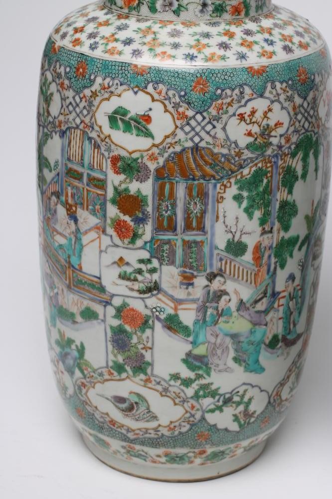 A PAIR OF CHINESE PORCELAIN ROULEAU VASES painted in famille verte enamels with panels enclosing Image